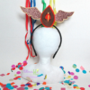 Tiara Vulva Livre - Vulva marrom e laranja com asas marrons.d